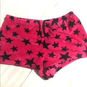 Pink fuzzy sleepware shorts.